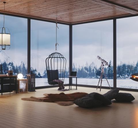 Gros plan sur le salon d'un magnifique chalet décoré avec goût en pleine montagne